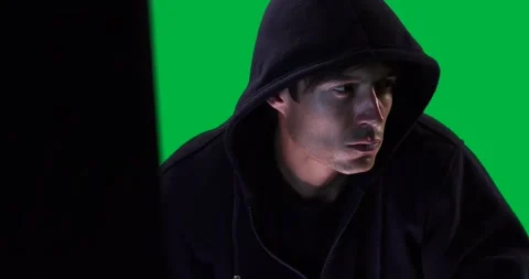 Caucasian man working on computer on green background Stock Footage 324845108