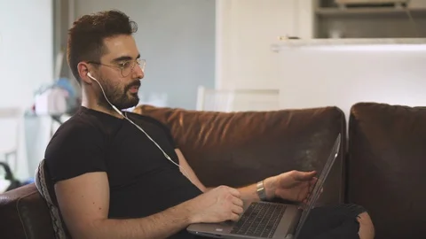 Caucasian man working from home with computer, work inside, during covid-19 Stock-Footage 129866339