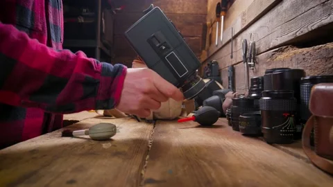 Caucasian Man Works On Retro 1970s Super 8mm Movie Film Camera In Workshop Vidéo 139125055
