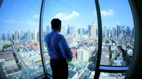 Caucasian manager making important call from his office looking Manhattan  Stock Footage 11960815
