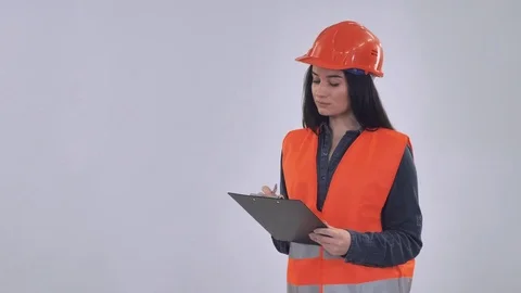 Caucasian manager wearing hard hat fill form Stock Footage 83236147