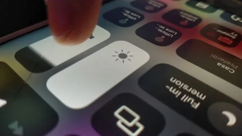 Caucasian man's hand mute iphone on setting. turn off volume on the phone. Stock Footage 235665523