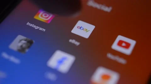 Caucasian man's hand open the ebay shopping app on the smartphone. Stock Footage 228906898