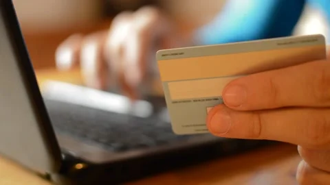 Caucasian man's hand using credit card for amazon shopping payment. Video stock 213577407