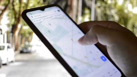 Caucasian man's hand using google gps app on his telephone. Video stock 217445643