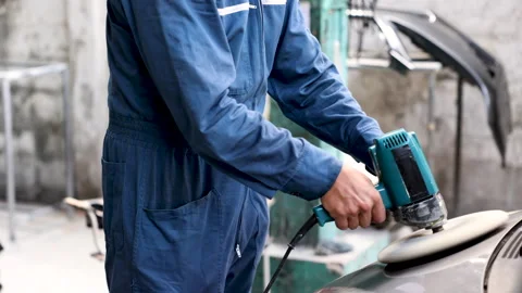 Caucasian mechanic man using grinding machine remove dust last checking bef.. Stock Footage 249334357
