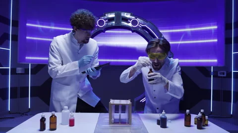 Caucasian men in white uniform developing new medical drugs in modern laboratory Stock Footage 240655657