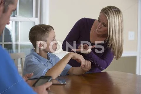 Caucasian Mother Signing With Deaf Son
