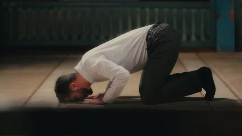 Caucasian Muslim Man Prostrating in Islamic Prayer. Ramadan Praying Stock Footage 263223974