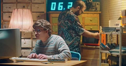 Caucasian nervous computer programist nerd in glasses working at vintage PC Stock-Footage 135630035