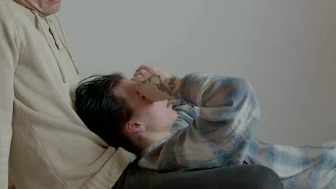 Caucasian partner resting head while gesturing expressively Stock Footage 325531025