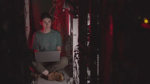 Caucasian Programmer on Floor of Data Center Video stock 162468919
