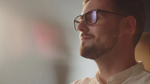 Caucasian programmer guy in glasses coding his first program. Finally done Stock Footage 274489033