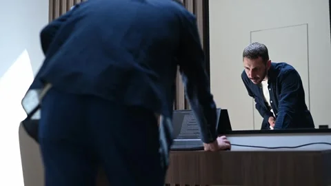 Caucasian programmer working on his laptop at a modern office, standing in front Stock Footage 323879343