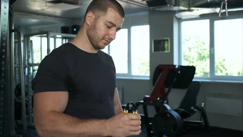 Caucasian pumped athlete doing another arm exercise in the gym in preparation Stock Footage 135348285
