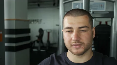 Caucasian pumped athlete doing another arm exercise in the gym in preparation Stock Footage 137100560