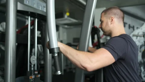 Caucasian pumped athlete doing another arm exercise in the gym in preparation Stock Footage 139041680