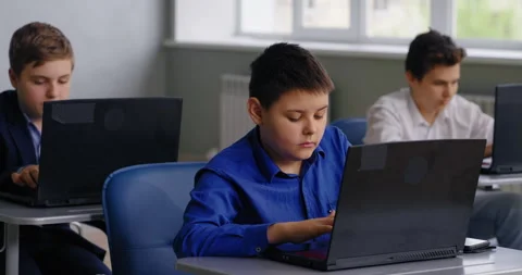 Caucasian Schoolboy Working With Laptop In Computer-Based Classroom, Coding And 스톡 동영상 280174184