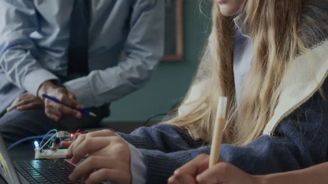 Caucasian Schoolgirl Practicing Coding on Laptop during Programming Lesson Stock Footage 284432756