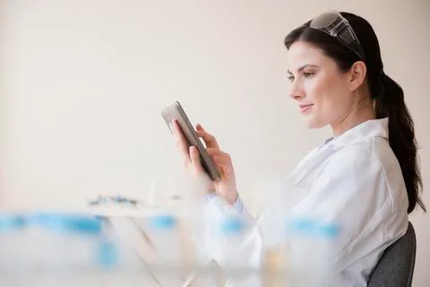 Caucasian scientist using digital tablet Stock Photos