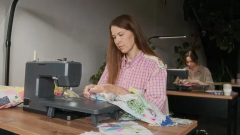 Caucasian Seamstress Working on Patchwork Garment on Sewing Machine Stock-Footage 315759560