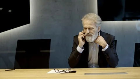 Caucasian senior CEO working late hours. talking on the phone. Stock Footage 121788965