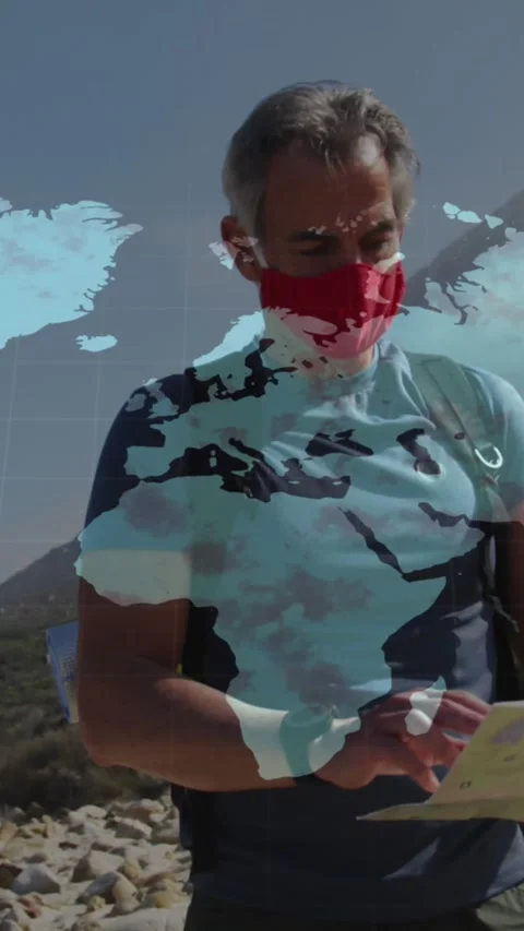 Caucasian senior man in face mask hiking reading map, over moving world map Stock Footage 342136205