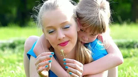 Caucasian sisters having fun in the park slow motion Stock Footage 24673470