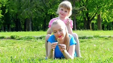 Caucasian sisters having fun in the park Stock Footage 24673486