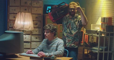 Caucasian smart computer programist nerd in glasses sitting at vintage PC Stock Footage 135630880