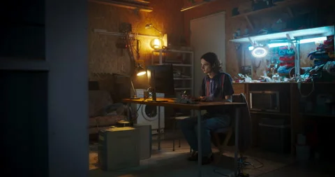 Caucasian Software Developer Using Computer In Garage Stock Footage 256000138