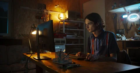 Caucasian Software Developer Using Computer In Garage Stock Footage 256000155