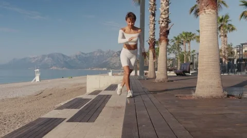 Caucasian sportswoman training using bench, doing exercises for legs. People Stock Footage 244346208