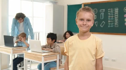 Caucasian student looking at camera while friend studying about code. Pedagogy. Stock Footage 267608256