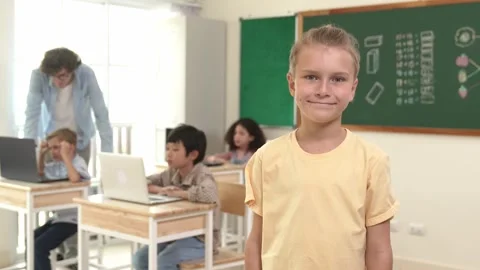 Caucasian student looking at camera while friend studying about code. Pedagogy. Stock Footage 274631868