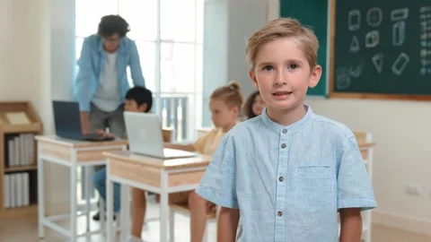 Caucasian student looking at camera while friend studying about code. Pedagogy. Stock Footage 279419846