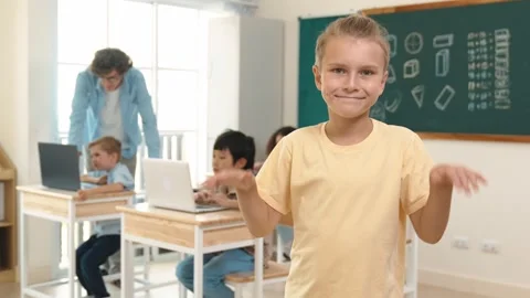 Caucasian student looking at camera while friend studying about code. Pedagogy. Stock Footage 283590530