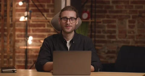 Caucasian Successful Freelancer looking at the Camera touching his Eyeglasses Video stock 150556986