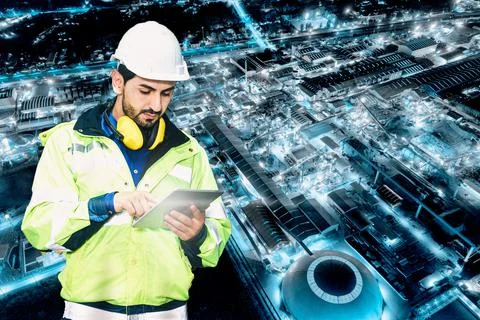 Caucasian technician engineer man using tablet checking the system on chemica Stock Photos