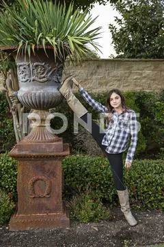 Caucasian teenage girl stretching leg in backyard Stock Photos