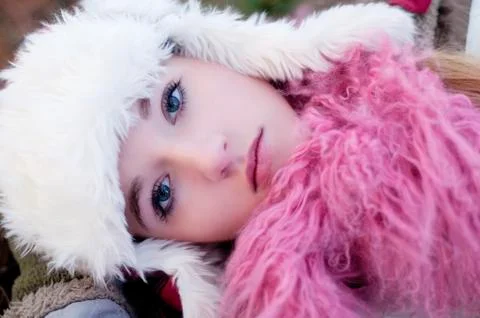 Caucasian teenage girl wearing fuzzy hat Stock Photos