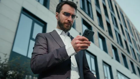 Caucasian tired man using mobile phone in city overworked businessman male ceo Stock Footage 249483050