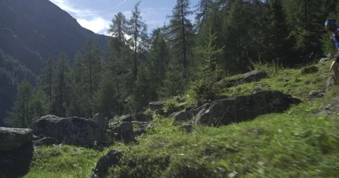 Caucasian trail runner running in mountain through woods, villages. 4k gimbal 스톡 동영상 74945262