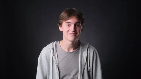 Caucasian Vlogger Talking on black Background Stockbeeldmateriaal 257474408