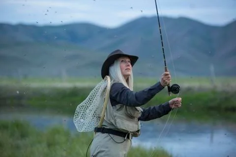 https://images.pond5.com/caucasian-woman-casting-fishing-line-photo-065130243_iconl_nowm.jpeg