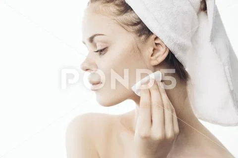 Caucasian Woman Cleaning Chin With Pad