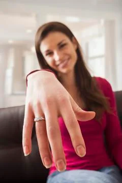 Caucasian woman displaying engagement ring Stock Photos