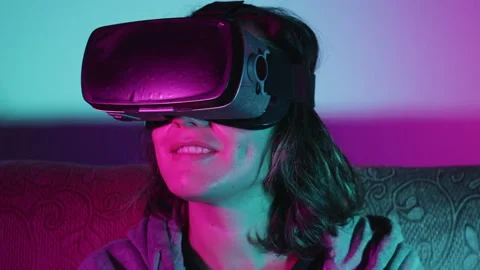 Caucasian woman exploring virtual augmented reality in the Metaverse Stock Footage 165692338