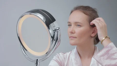caucasian woman with mirror with ring li... | Stock Video | Pond5