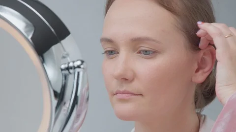 caucasian woman with mirror with ring li... | Stock Video | Pond5